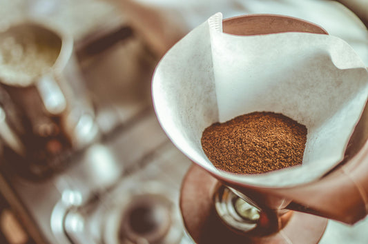 Ground coffee in paper filter